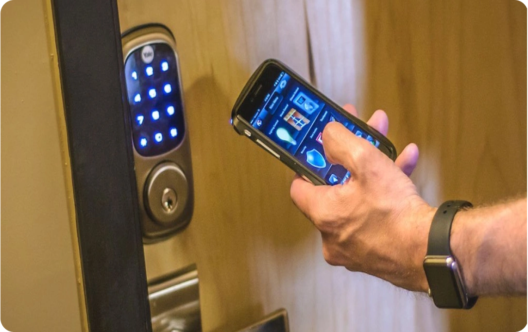 a person using a phone to open a door